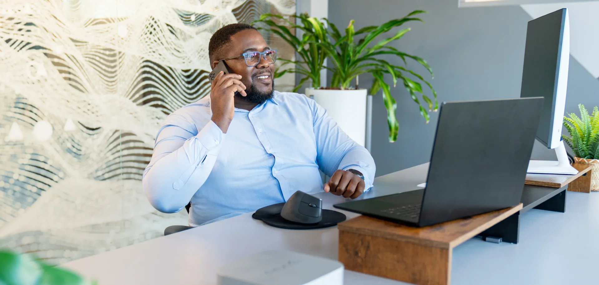 Person holding smartphone messaging conversational agent